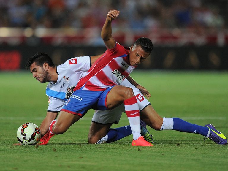 Darwin Machis (R) of Granada CF battles for the ball against Pablo Insua of Deportivo La Coruna
