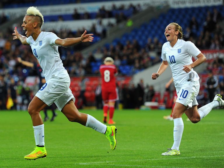Lianne Sanderson (l) celebrates scoring England's fourth goal