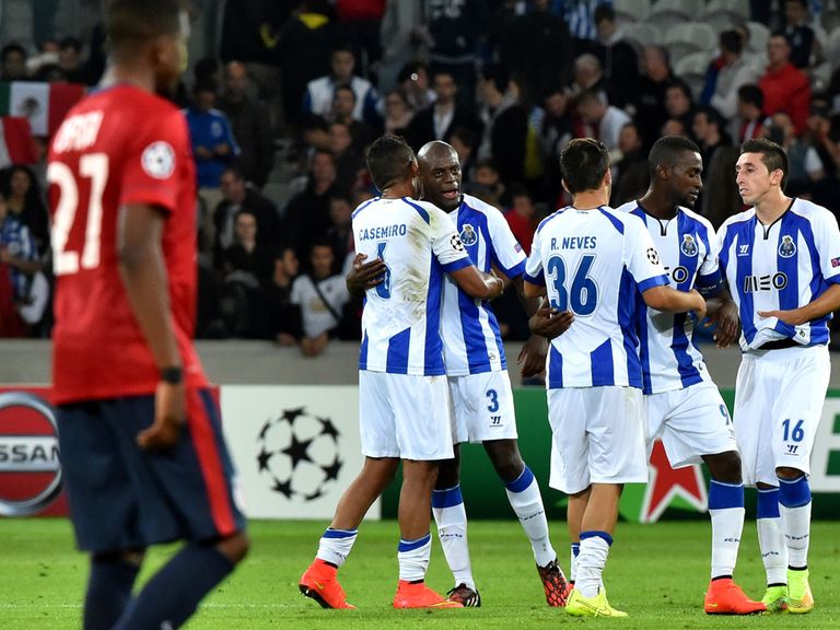 Porto's players celebrate at the end of the League play-off first leg at Lille