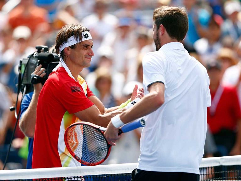 David Ferrer (left) was ousted by Gilles Simon