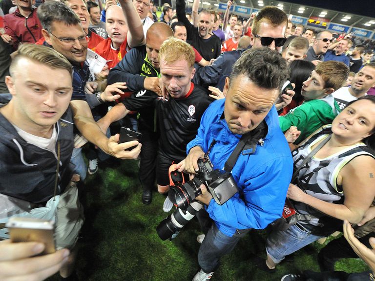 Paul Scholes is mobbed by fans after the final whistle