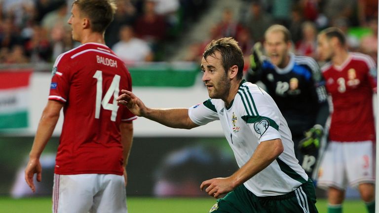 Niall McGinn: Celebrates after equalising