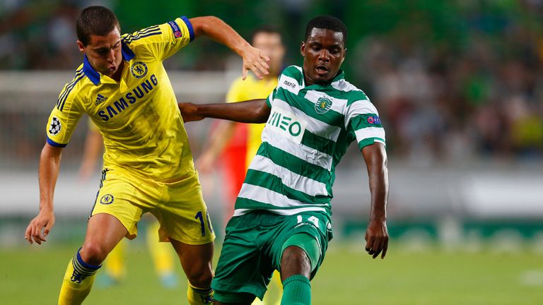 William Carvalho of Sporting Lisbon battles with Chelsea's Eden Hazard