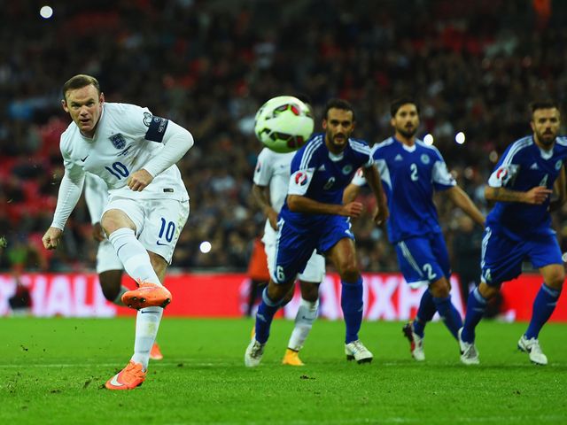 Wayne Rooney scores from the penalty spot