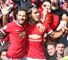 Juan Mata and Radamel Falcao celebrate at Old Trafford on October 5, 2014 in Manchester, England.