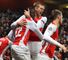 Yaya Sanogo: Celebrates with Per Mertesacker