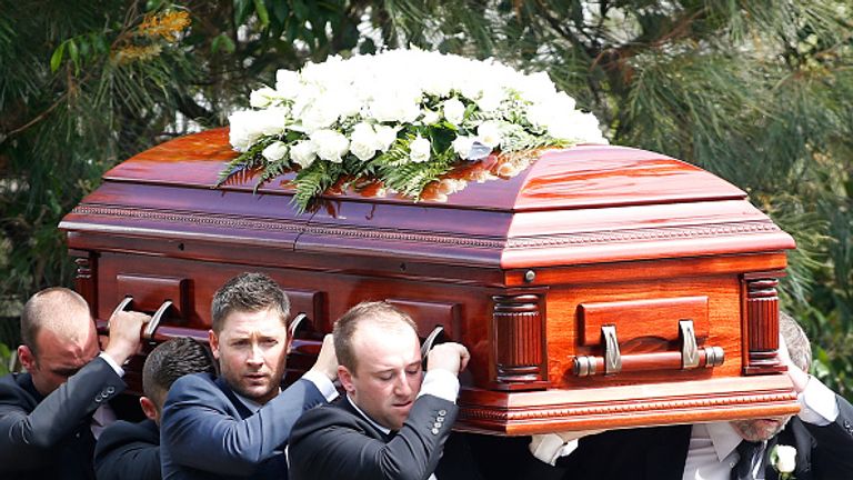 Australia captain Michael Clarke and Jason Hughes carry the coffin