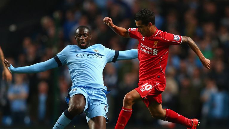 Toure (31) tackles Coutinho (22)