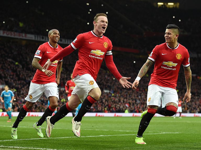 Wayne Rooney (C) believes Manchester United are 'back where we belong' after they claimed a Champions League place