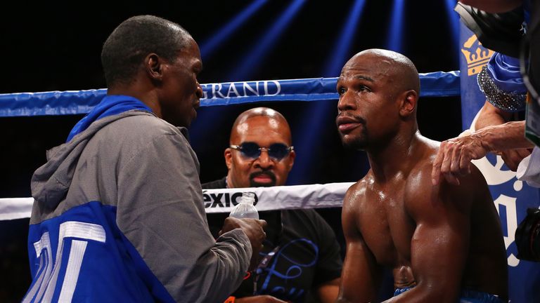 Floyd Mayweather Sr. talks with his son Floyd Mayweather Jr