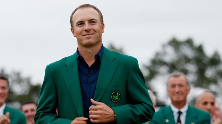 Spieth slips on the Green Jacket after his record-breaking Masters win