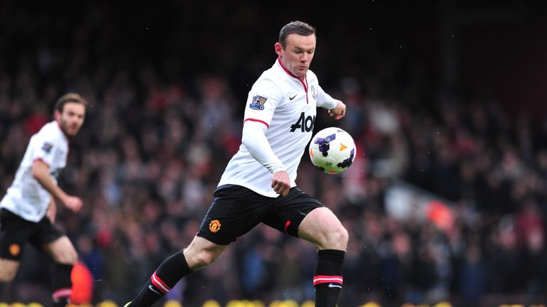 Wayne Rooney shoots to score the opening goal during the game against West Ham