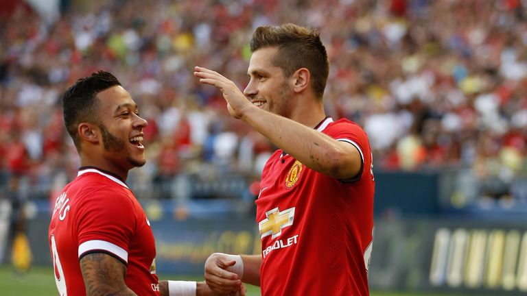 Morgan Schneiderlin celebrates scoring on his Manchester United debut