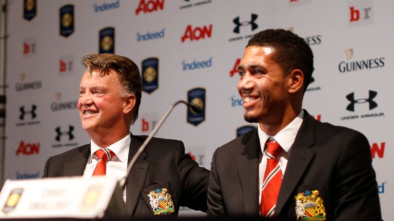Manchester United manager Louis van Gaal (left) says Chris Smalling will one day captain the club