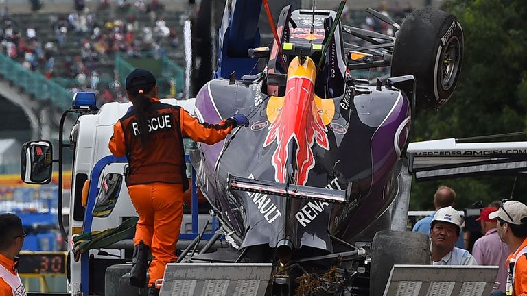 The wrecked car of Kvyat is returned to the Red Bull team