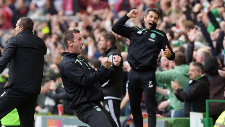 Ronny Deila (centre) celebrates with John Collins (right) and John Kennedy (l) as Celtic take the lead against Aberdeen