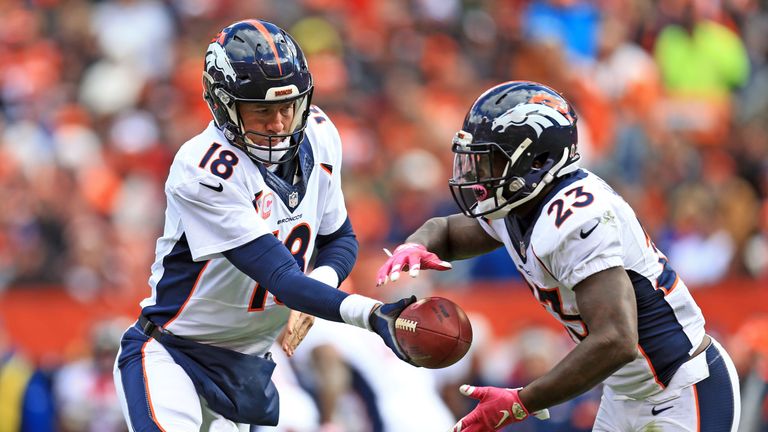 Peyton Manning hands the ball off to Broncos running back Ronnie Hillman