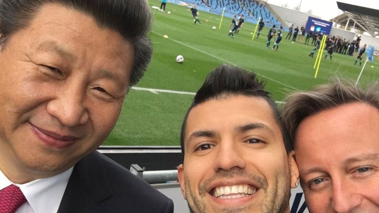 Sergio Aguero poses for a photo with China's president Xi Jinping and former prime minister David Cameron