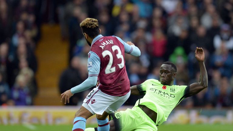 Manchester City defender Bacary Sagna (R) tackles Villa's Jordan Amavi