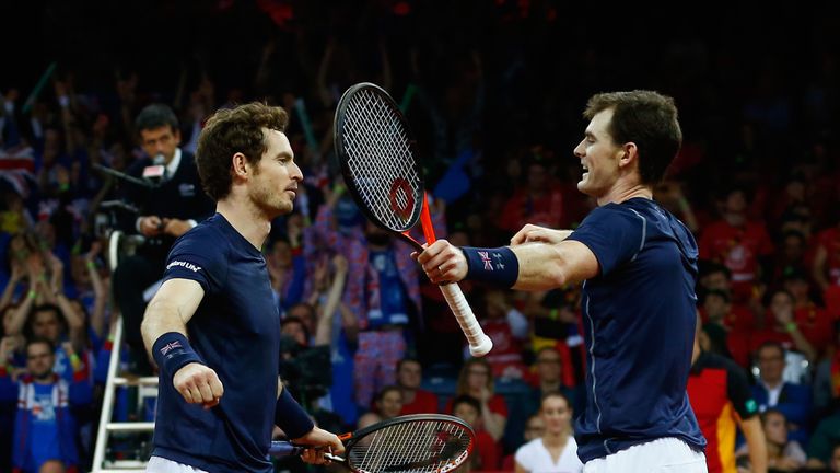 Jamie Murray and Andy Murray of Great Britain celebrate defeating Steve Darcis and David Goffin of Belgium