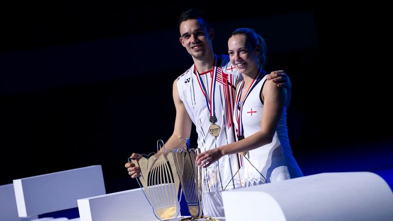 The husband and wife team pose with their winners' trophies