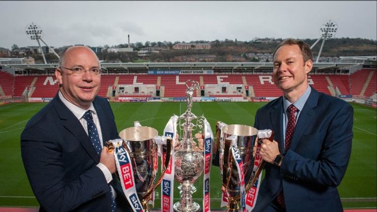 Football League chief executive Shaun Harvey and Sky Bet chief executive Richard Flint with the Football League's three main trophies