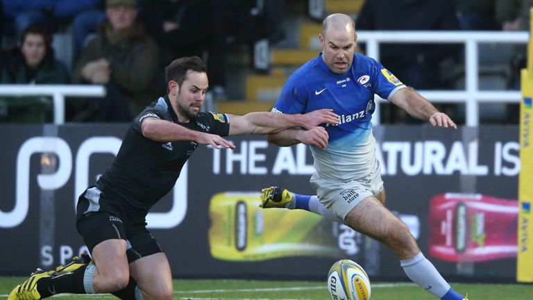 Charile Hodgson (right) competes for possession with Micky Young