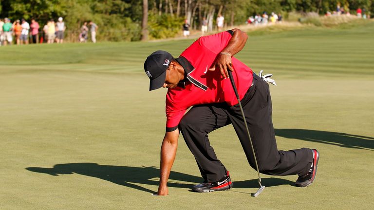 The American struggled to bend over during the final round of the Barclays
