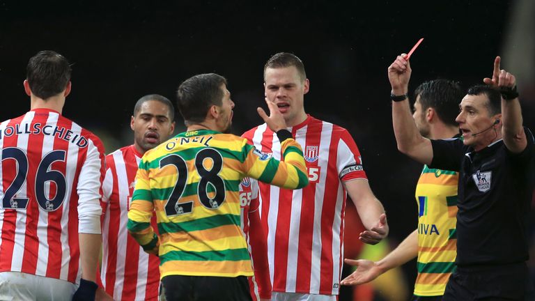 Norwich midfielder Gary O'Neil was sent off for a poor challenge on Ibrahim Afellay