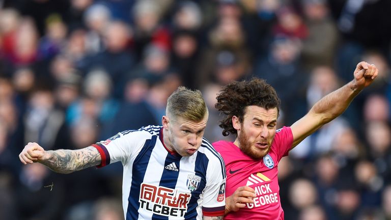James McClean and Lawrie Wilson compete for the ball