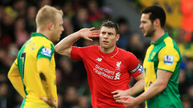 James Milner celebrates after his strike at Carrow Road