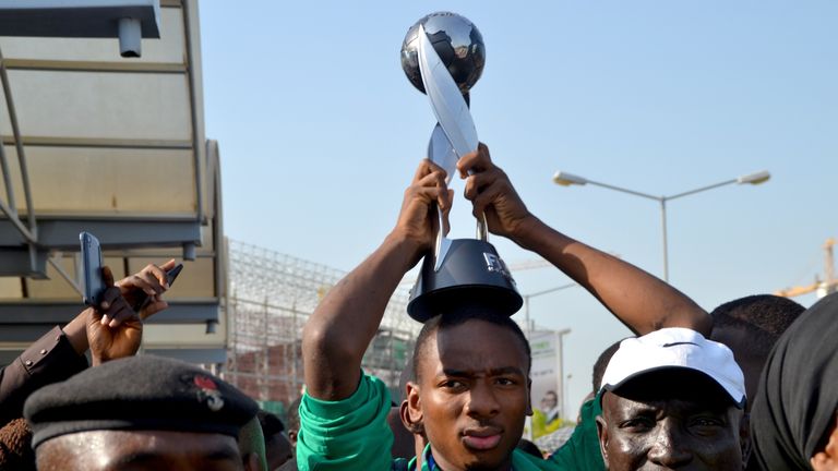 Nigeria's Kelechi Nwakali carries the Fifa U17 World Cup trophy on his head