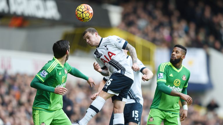 Tottenham's Kieran Trippier heads the ball away
