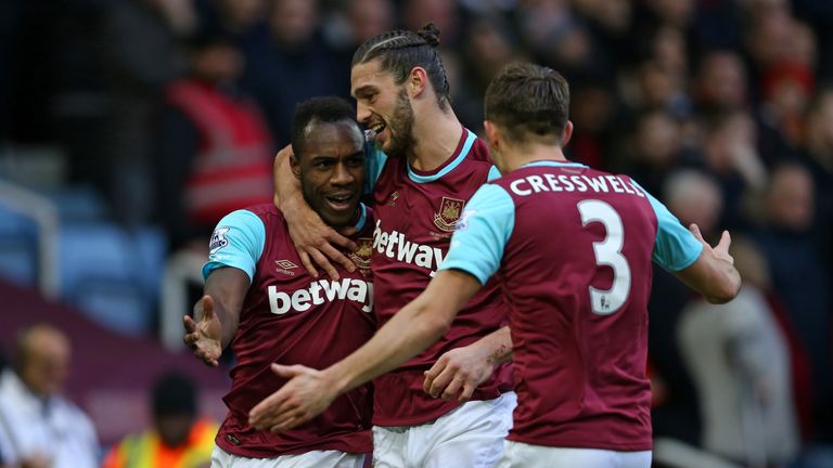 Antonio (left) celebrates with Carroll and Aaron Cresswell