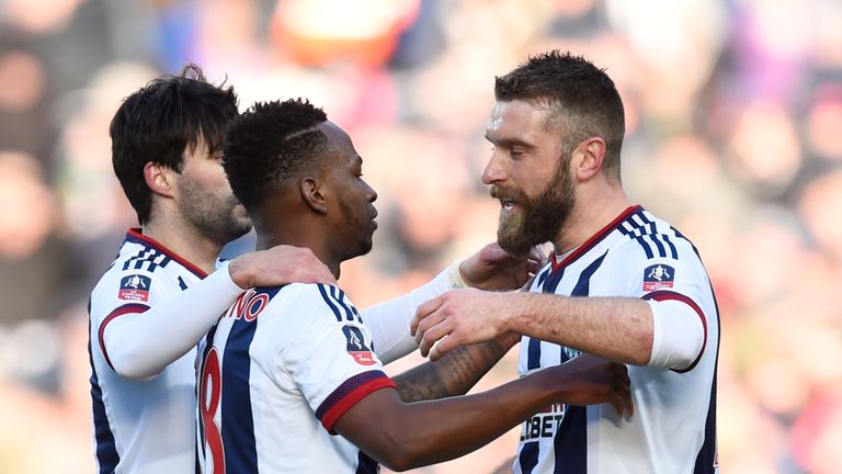 Berahino (C) celebrates scoring West Brom's first goal against Peterborough with his team-mates Rickie Lambert (R) and Claudio Yacob (L)