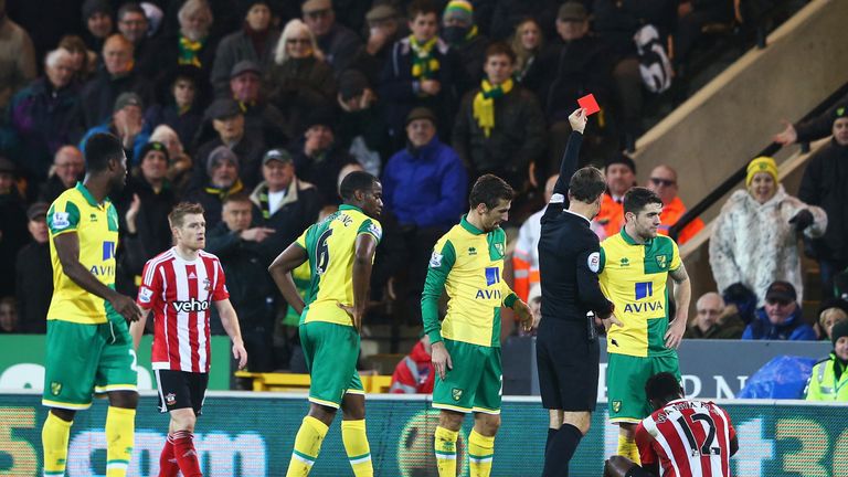 Wanyama (sitting down) was sent off during the second half against Norwich