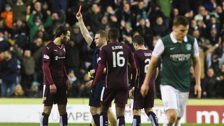 Hearts' Blazej Augustyn (left) is shown a red card during the second half