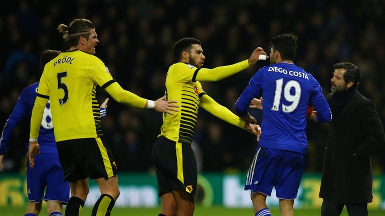 Etienne Capoue confronts Costa after the Chelsea forward had clashed with Juan Carlos Paredes