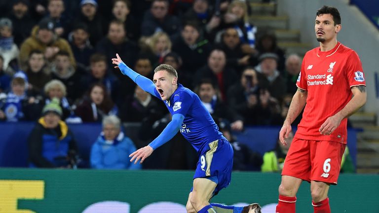 Vardy (left) celebrates scoring the opening goal against Liverpool