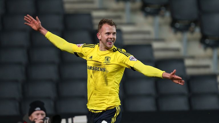 Jordan Rhodes celebrates after scoring Middlesbrough's equaliser and earning them a point against MK Dons