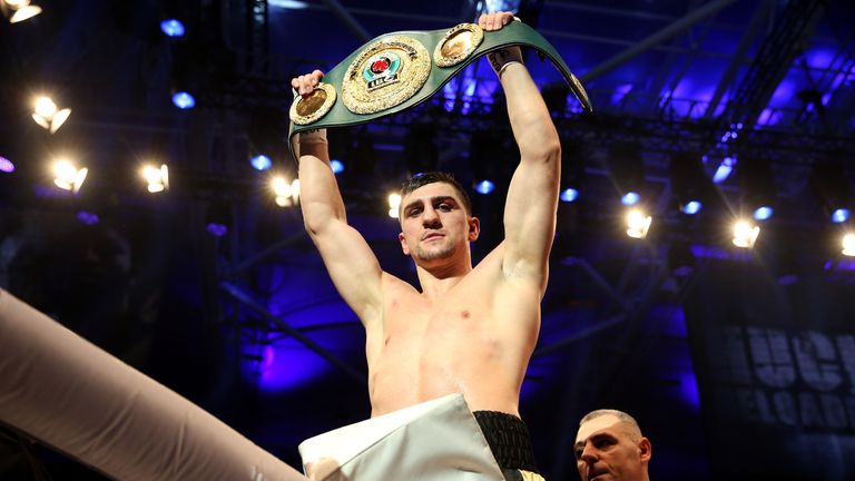 Marco Huck celebrates after winning the IBO cruiserweight title