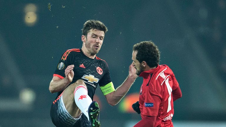 Manchester United's captain Michael Carrick (left) apologised to fans after their defeat to FC Midtjylland