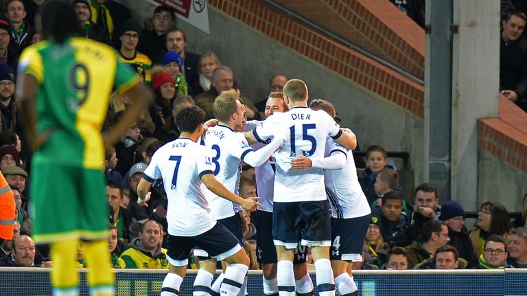 Tottenham players celebrate their team's first goal by Dele Alli