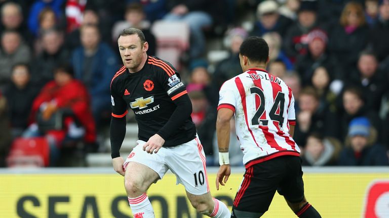 Wayne Rooney controls the ball under pressure of DeAndre Yedlin