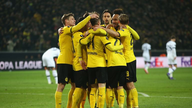 Reus is congratulated after scoring