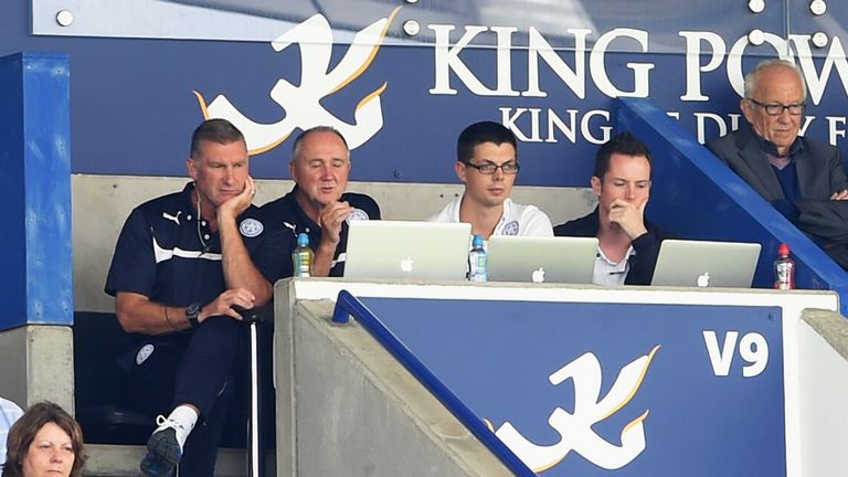 Former Leicester manager Nigel Pearson watches on from the stand next to the club's head of recruitment, Steve Walsh