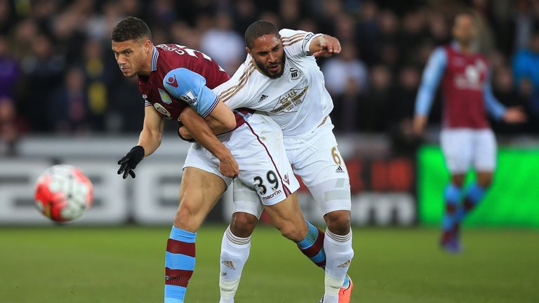 Rudy Gestede and man of the match Ashley Williams compete for the ball