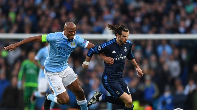 Kompany and Bale battle for the ball in the goalless first leg