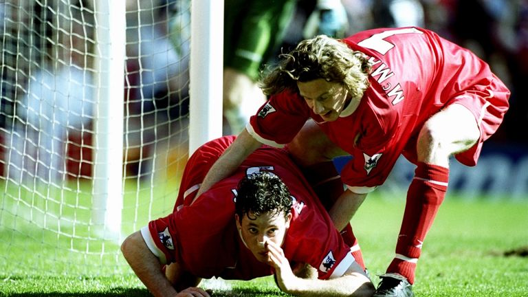 Robbie Fowler celebrates in his unique style alongside Steve McManaman