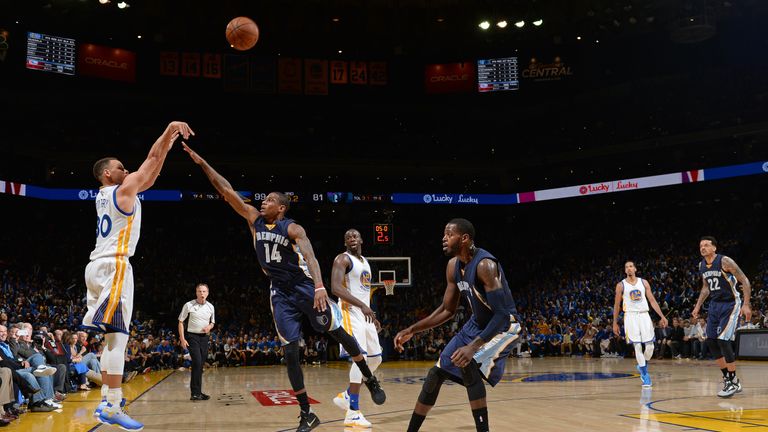 Stephen Curry shoots on his way to becoming the first player to score 400 three-pointers in one season